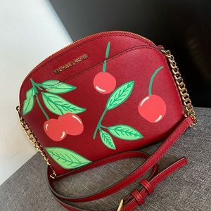 Burgundy & Gold Strappy Michael Kors purse.